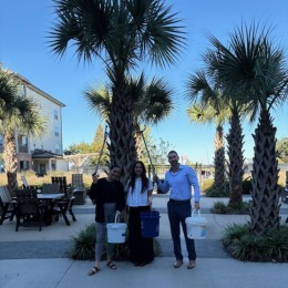 people standing by palm tree